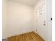 Bright entryway features wood-look floors and a white front door with glass panels at 79 Turner Dr, Mcdonough, GA 30252