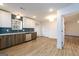 Well-lit kitchen features stainless appliances, modern cabinets, and hardwood floors, offering a clean design at 79 Turner Dr, Mcdonough, GA 30252