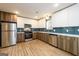 This is a modern kitchen with stainless steel appliances and stylish cabinetry and countertops at 79 Turner Dr, Mcdonough, GA 30252