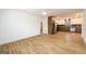 Open concept living space featuring modern wood flooring flowing into the kitchen at 79 Turner Dr, Mcdonough, GA 30252