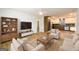 Bright living room featuring hardwood floors, contemporary furniture, and an open layout to the kitchen at 79 Turner Dr, Mcdonough, GA 30252