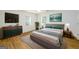 Comfortable, neutral colored main bedroom with decor, carpet, and blinds on windows at 79 Turner Dr, Mcdonough, GA 30252