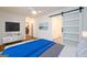 Comfortable bedroom featuring a sliding door, large television, and cool-toned accents at 79 Turner Dr, Mcdonough, GA 30252