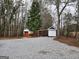 Property with outbuildings and gravel driveway at 79 Turner Dr, Mcdonough, GA 30252
