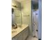 Bathroom featuring double sinks, a toilet, and a bathtub with shower and floral shower curtain at 171 Galesburg Dr, Lawrenceville, GA 30044