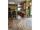 Bright kitchen features wood cabinetry, a breakfast bar, and tiled flooring at 171 Galesburg Dr, Lawrenceville, GA 30044
