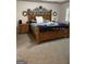 Spacious main bedroom with a large bed, decorative mirrors, and carpeted flooring at 171 Galesburg Dr, Lawrenceville, GA 30044