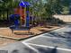 Community playground featuring a slide, climbing wall, picnic tables and swing set at 171 Galesburg Dr, Lawrenceville, GA 30044