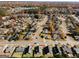 Overhead view of a residential neighborhood with tree-lined streets and well-maintained homes at 351 Autumn Lake Dr, Mcdonough, GA 30253