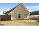 View of the home's backyard with wood fence, lush lawn, and siding at 351 Autumn Lake Dr, Mcdonough, GA 30253