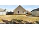 Large, fenced backyard featuring a spacious lawn and a storage shed, perfect for outdoor enjoyment at 351 Autumn Lake Dr, Mcdonough, GA 30253