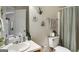 Stylish bathroom featuring a vanity, toilet, shower with decorative plants and art at 351 Autumn Lake Dr, Mcdonough, GA 30253