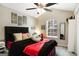 Cozy bedroom showcasing a vaulted ceiling, ceiling fan, and a bright window with natural light at 351 Autumn Lake Dr, Mcdonough, GA 30253