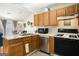 Well-lit kitchen boasts stainless steel appliances, white countertops, and eat-in breakfast area at 351 Autumn Lake Dr, Mcdonough, GA 30253