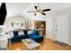 Bright living room featuring a vaulted ceiling, fan, and hardwood floors at 351 Autumn Lake Dr, Mcdonough, GA 30253