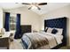 Comfortable primary bedroom features a vaulted ceiling, plush carpet, and a large window at 351 Autumn Lake Dr, Mcdonough, GA 30253