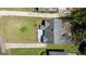 An aerial view highlighting the roof, driveway, and yard of the property on a sunny day at 1774 Campbellton Rd, Atlanta, GA 30311