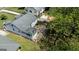 An aerial view showing the property with a patio and mature trees in a green landscape at 1774 Campbellton Rd, Atlanta, GA 30311