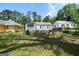 Green backyard with view of the back side of a single-story home at 1774 Campbellton Rd, Atlanta, GA 30311