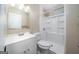 Bathroom featuring updated vanity, mirror, toilet and tiled shower at 1774 Campbellton Rd, Atlanta, GA 30311
