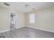 Bedroom with neutral walls, new floors and ample natural light at 1774 Campbellton Rd, Atlanta, GA 30311