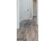 Attractive laminate flooring and view of a bathroom and shower stall at 1774 Campbellton Rd, Atlanta, GA 30311