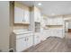 Bright kitchen with white cabinets, modern countertops, and neutral flooring at 1774 Campbellton Rd, Atlanta, GA 30311