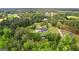 Lush aerial showcasing a private estate surrounded by mature trees at 550 Davis Rd, Fayetteville, GA 30215