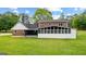 Spacious backyard with well-maintained lawn and enclosed porch at 550 Davis Rd, Fayetteville, GA 30215