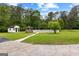 Large backyard with a gazebo and storage shed beyond a fenced in-ground pool at 550 Davis Rd, Fayetteville, GA 30215