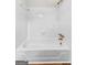 Clean, bright bathroom features a white tiled shower over tub with gold fixtures at 550 Davis Rd, Fayetteville, GA 30215