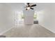 Large bedroom features plush carpeting, a ceiling fan, and a cozy window seat with desk at 550 Davis Rd, Fayetteville, GA 30215