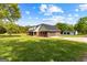 Traditional home with multi-car garage and meticulously kept lawn at 550 Davis Rd, Fayetteville, GA 30215