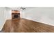 Spacious living room featuring hardwood floors and a cozy brick fireplace at 550 Davis Rd, Fayetteville, GA 30215
