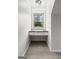 Cozy office nook featuring built-in desk and bright window with tranquil outdoor view, ideal for remote work at 550 Davis Rd, Fayetteville, GA 30215