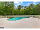 Inviting inground pool and stone hot tub perfect for relaxation and entertaining at 550 Davis Rd, Fayetteville, GA 30215