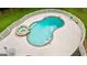 Aerial view showcasing the inground pool and stone hot tub surrounded by a white fence at 550 Davis Rd, Fayetteville, GA 30215