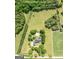 Sprawling estate features lush acreage, mature trees, inground pool, and charming home at 1040 Rock Creek Rd, Social Circle, GA 30025