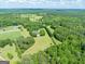 Expansive green property, the site features mature trees and plenty of privacy at 1040 Rock Creek Rd, Social Circle, GA 30025