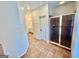 Bathroom features walk-in shower with tile surround and glass doors at 1040 Rock Creek Rd, Social Circle, GA 30025
