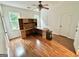 Large bedroom features hardwood flooring, two windows, and an open built in desk and storage space at 1040 Rock Creek Rd, Social Circle, GA 30025