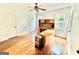 Bedroom with hardwood floors, natural light, and ample space; ideal for relaxation or a functional home office at 1040 Rock Creek Rd, Social Circle, GA 30025