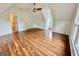 Bright bonus room boasts wood floors, a ceiling fan, and built in storage; a versatile and inviting space at 1040 Rock Creek Rd, Social Circle, GA 30025
