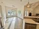 Dining room area with windows overlooking the pool and access to kitchen at 1040 Rock Creek Rd, Social Circle, GA 30025