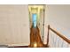 Hallway with hardwood floors leading to other rooms at 1040 Rock Creek Rd, Social Circle, GA 30025
