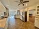 Spacious open kitchen with stainless appliances, tile flooring and view to backyard at 1040 Rock Creek Rd, Social Circle, GA 30025
