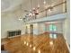 Open concept living room with hardwood floors, high ceilings and staircase to the second floor at 1040 Rock Creek Rd, Social Circle, GA 30025