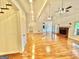 Spacious living room with fireplace, wood floors, and access to the backyard at 1040 Rock Creek Rd, Social Circle, GA 30025