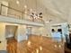 Open living room with high ceilings, wood floors, and an open floor plan at 1040 Rock Creek Rd, Social Circle, GA 30025