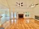 Spacious living room with hardwood floors, fireplace and views to a pool through French doors at 1040 Rock Creek Rd, Social Circle, GA 30025